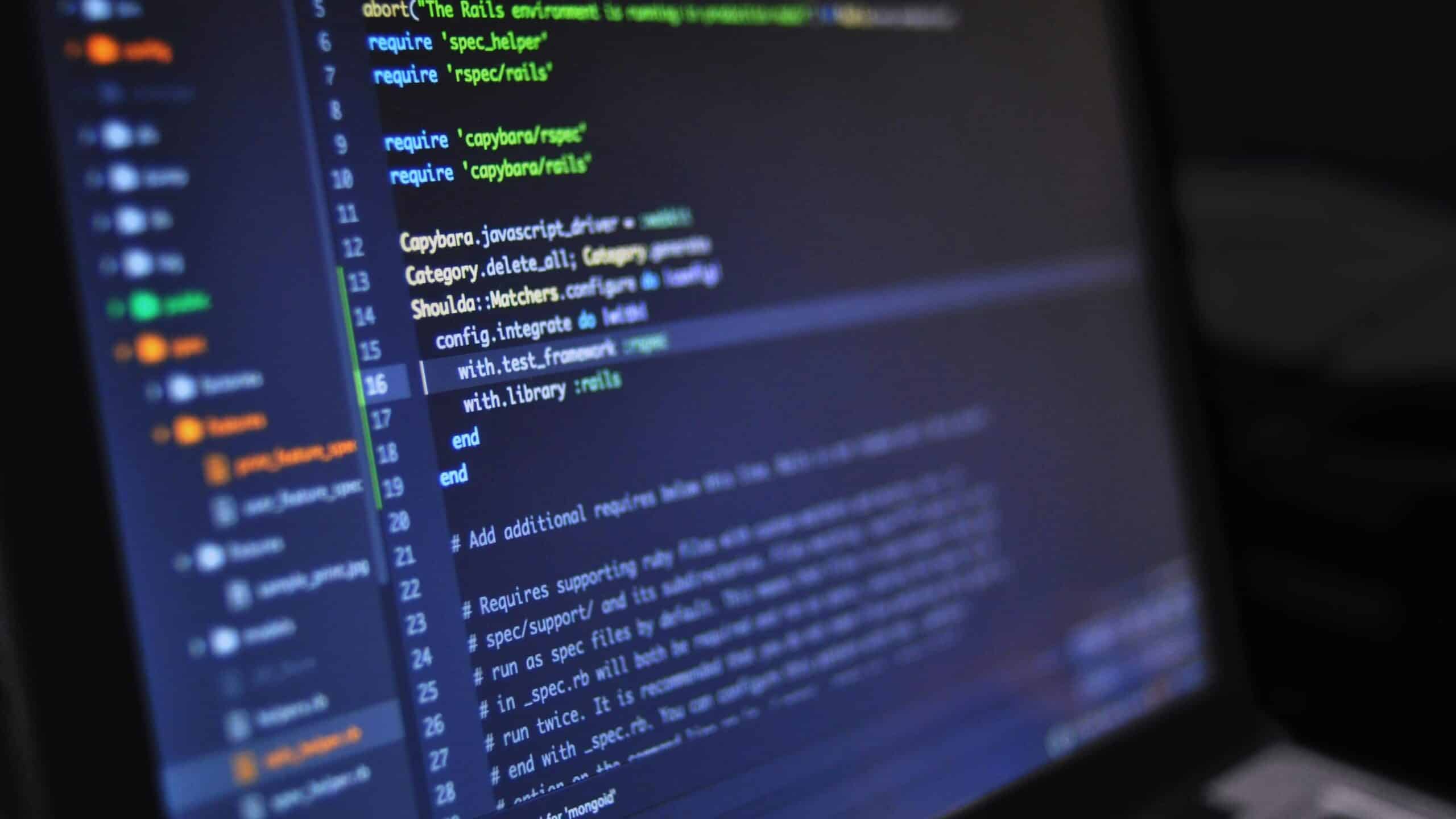 Close-up of colorful syntax-highlighted programming code on a dark screen